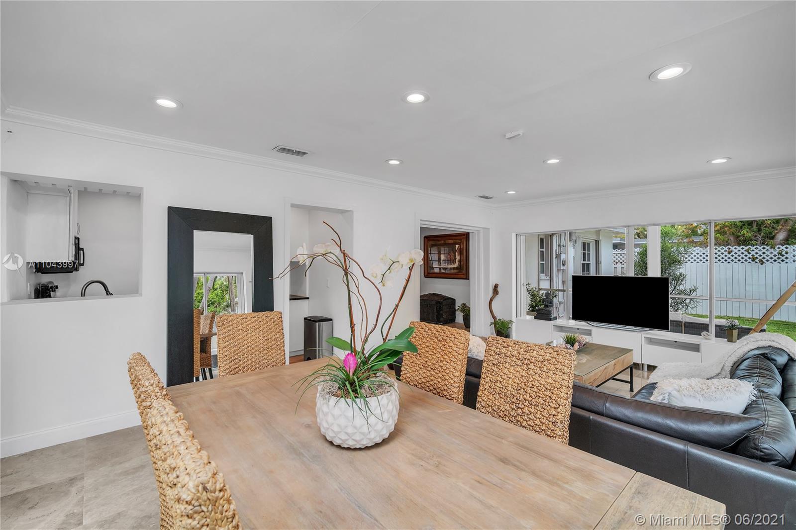 774 Fernwood Road Key Biscayne, FL 33149 - Photo 6 of 36 a living room with furniture and a flat screen tv