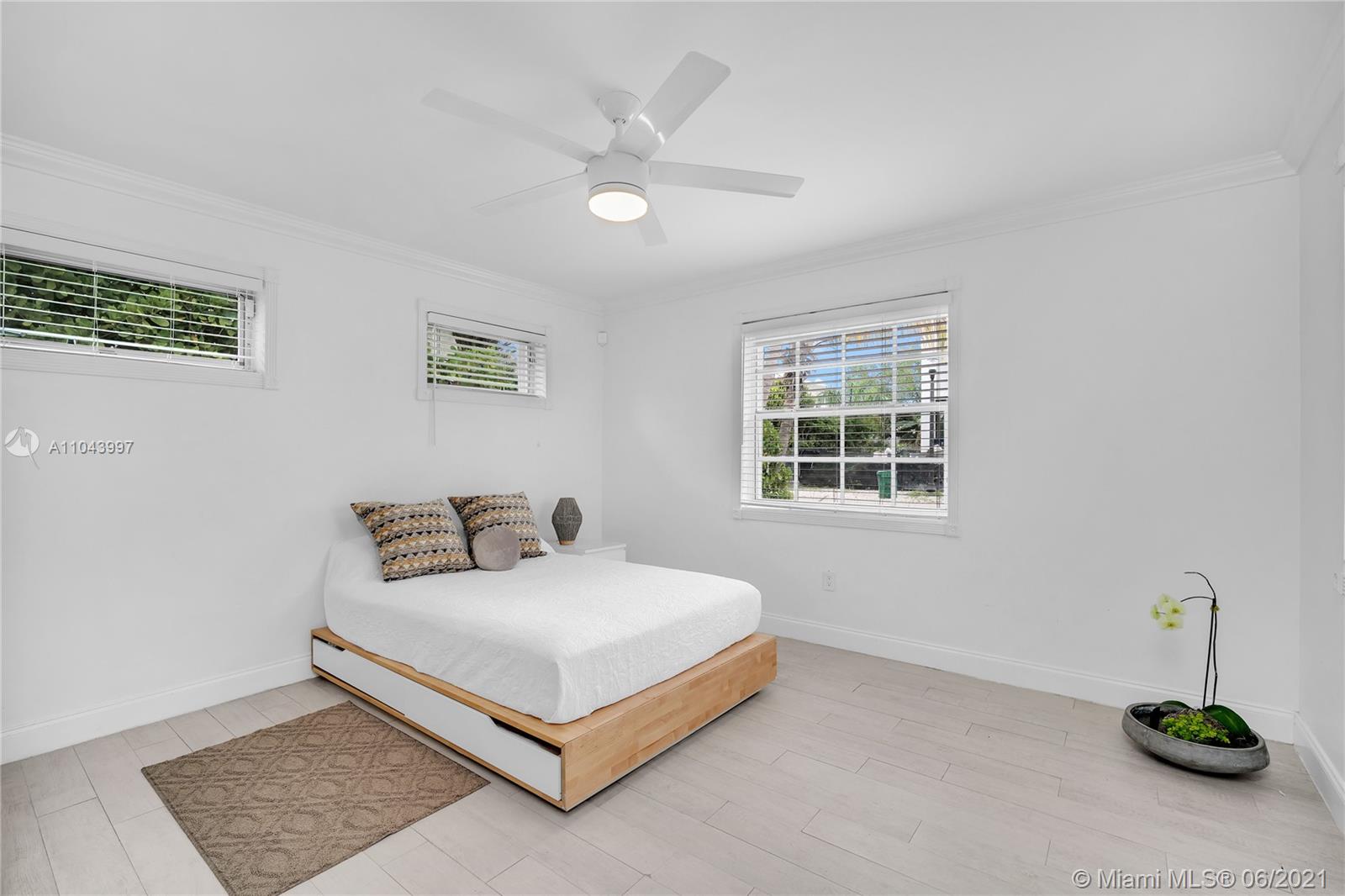 774 Fernwood Road Key Biscayne, FL 33149 - Photo 7 of 36 a bedroom with a bed and a window