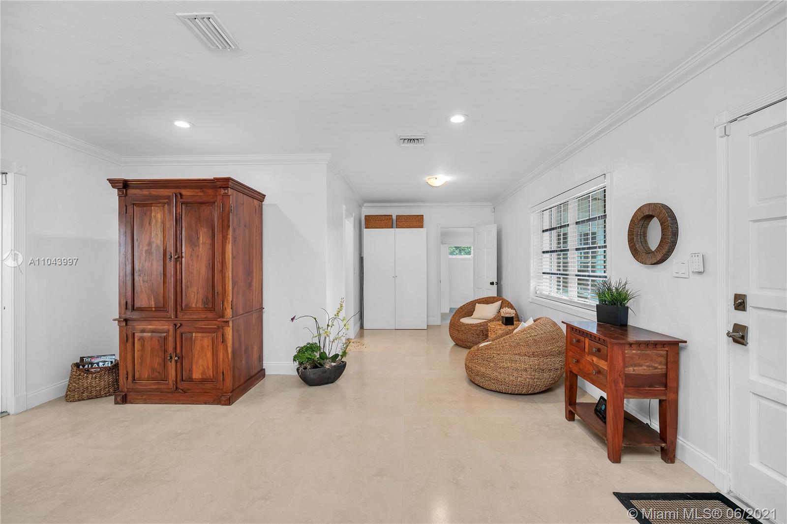 774 Fernwood Road Key Biscayne, FL 33149 - Photo 9 of 36 a living room with furniture and a window