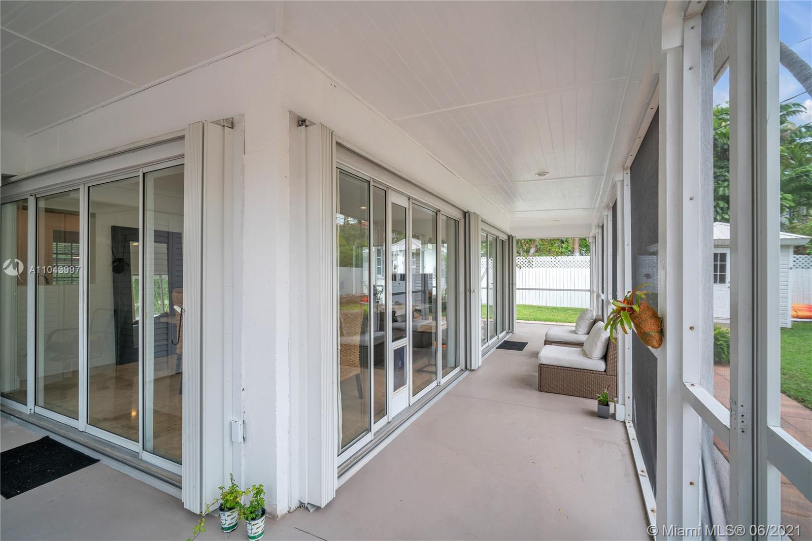 774 Fernwood Road Key Biscayne, FL 33149 - Photo 10 of 36 a view of livingroom with furniture and floor to ceiling window