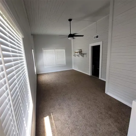 a view of empty room with windows