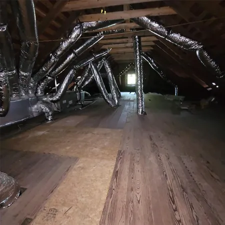 a view of room with wooden floor