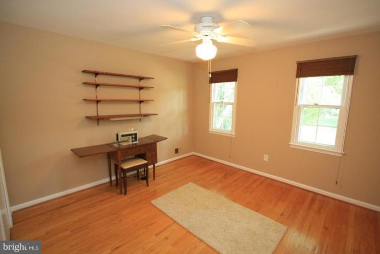 14108 Ansted Road Silver Spring, MD 20905 - Photo 14 of 24 a view of a workspace with furniture and a window