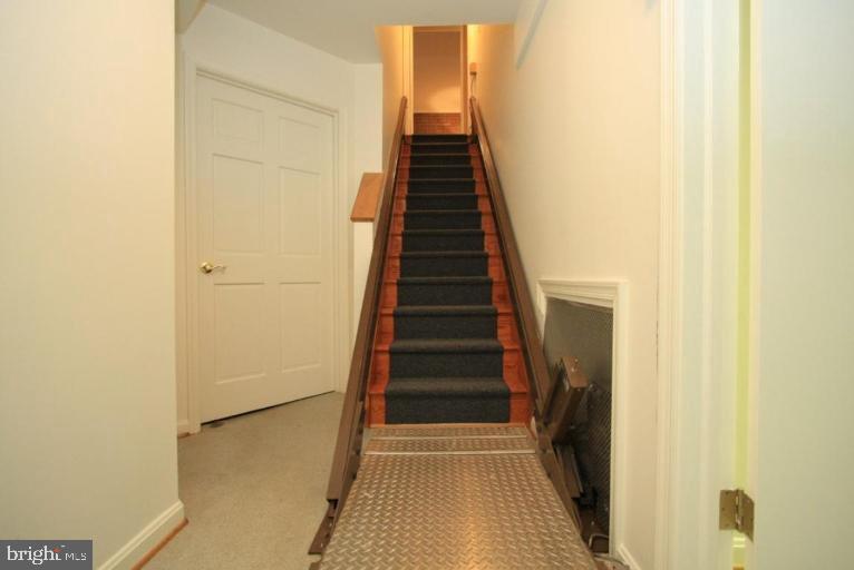 14108 Ansted Road Silver Spring, MD 20905 - Photo 22 of 24 a view of a hallway with wooden floor and entryway