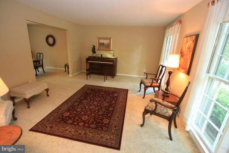 14108 Ansted Road Silver Spring, MD 20905 - Photo 5 of 24 a living room with a rug and a window