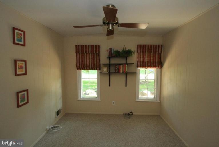 14108 Ansted Road Silver Spring, MD 20905 - Photo 7 of 24 a view of empty room with windows