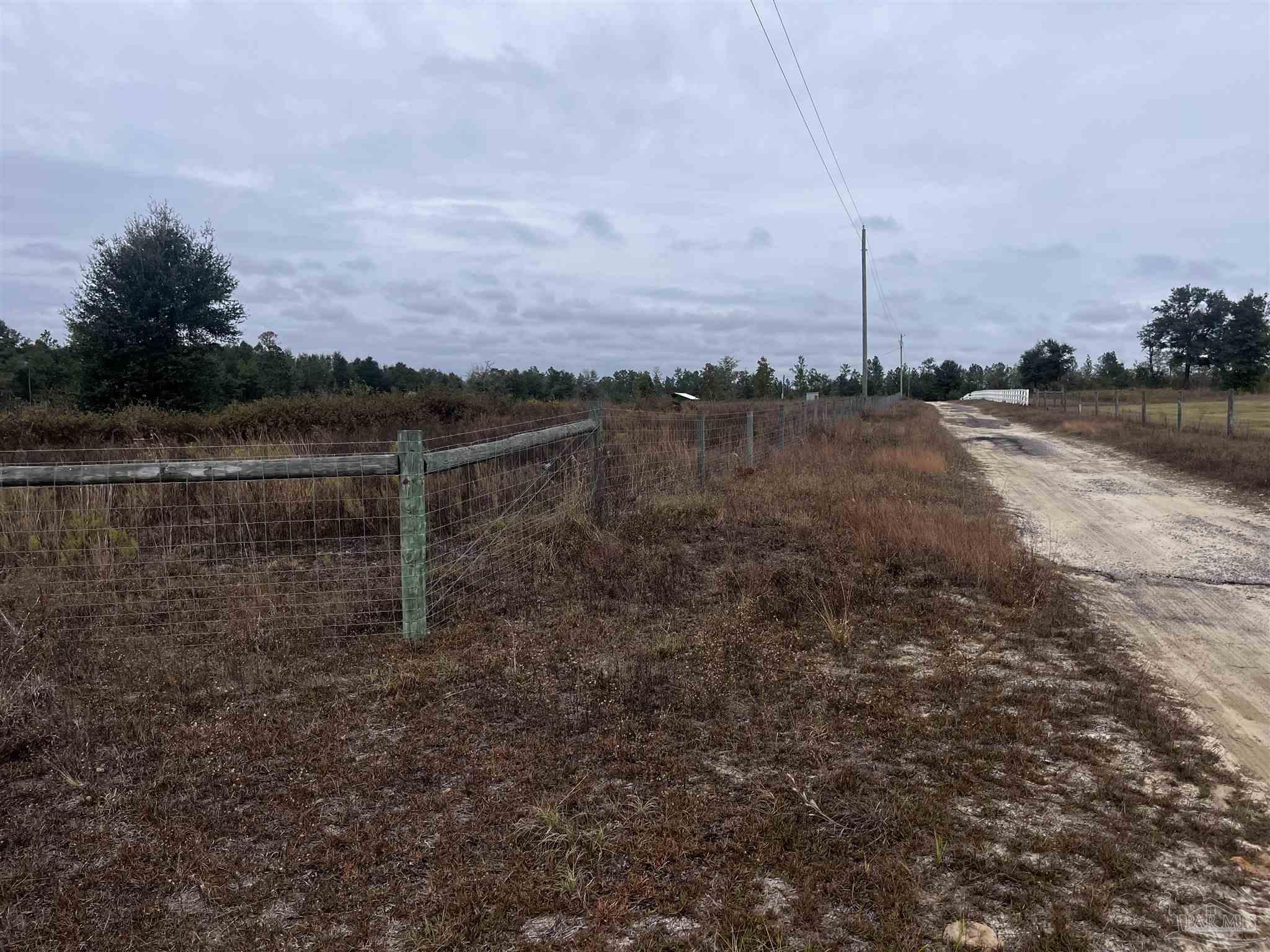 0 Tanner Ridge Road Milton, FL 32570 - Photo 16 of 18 a view of a lake with a mountain in the background