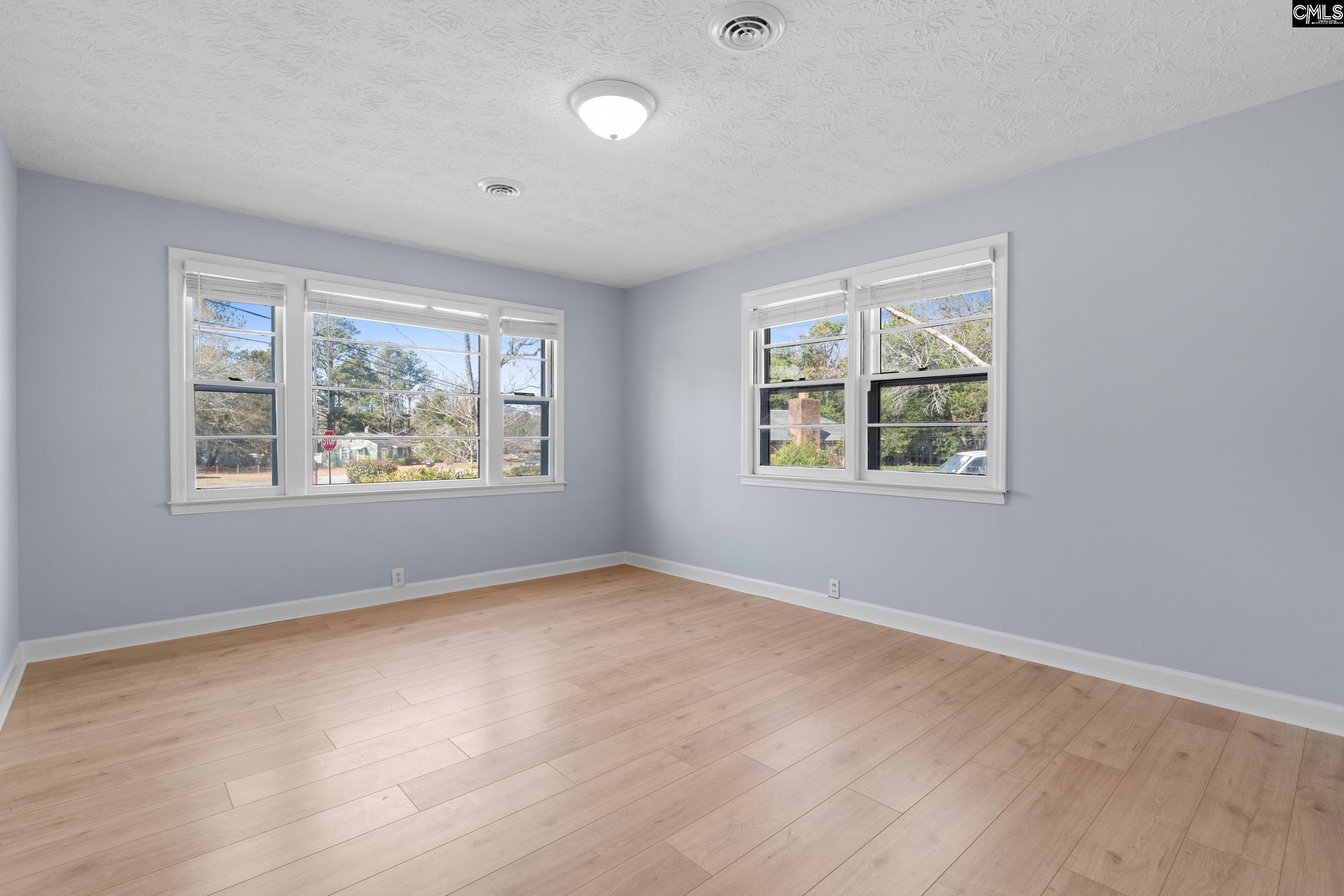 409 Wilkes Road Columbia, SC 29203 - Photo 26 of 34 an empty room with windows and closet