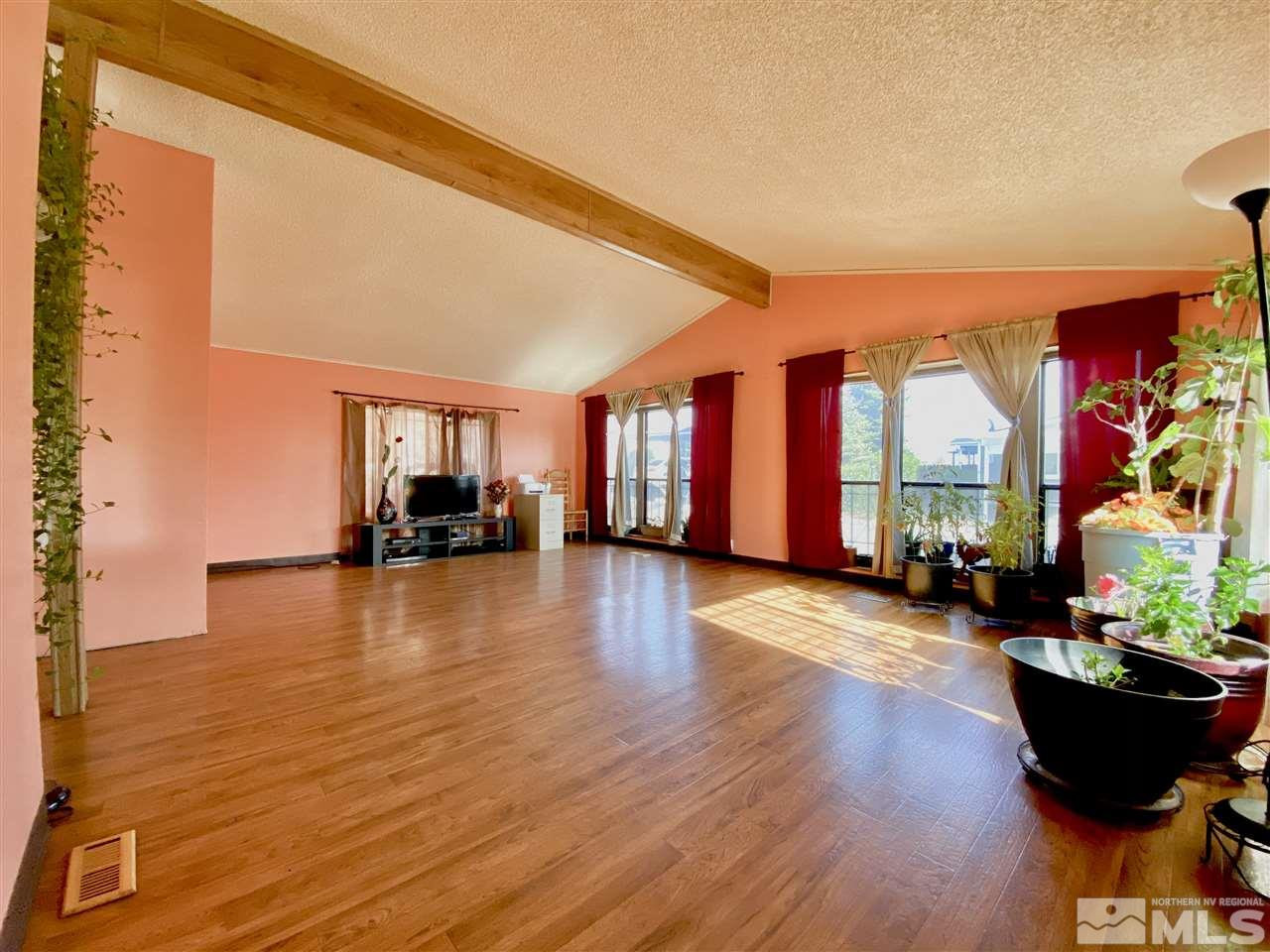2675 Daffodil Way Reno, NV 89512 - Photo 2 of 3 a living room with furniture and a wooden floor
