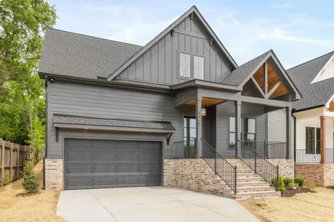a front view of a house with garage