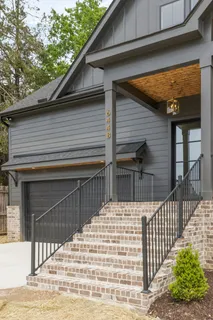 a view of house with wooden fence