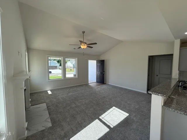 a view of livingroom with hardwood floor and hallway