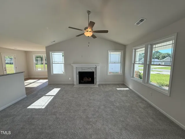 a view of livingroom window fireplace and windows
