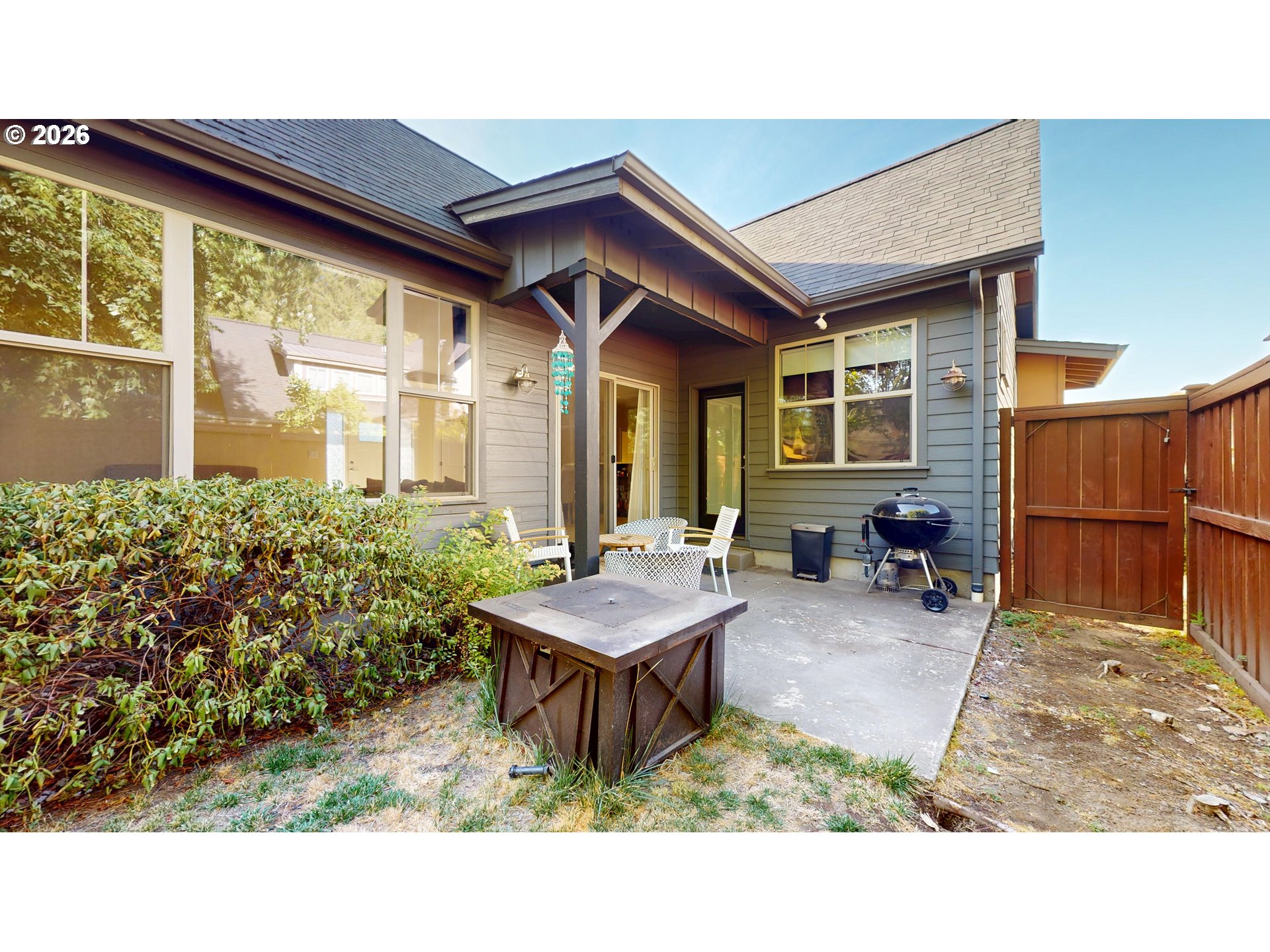 375 Mia Lane Eugene, OR 97401 - Photo 40 of 44 a backyard of a house with barbeque oven table and chairs