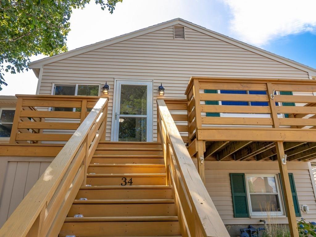 a front view of a house with wooden stairs