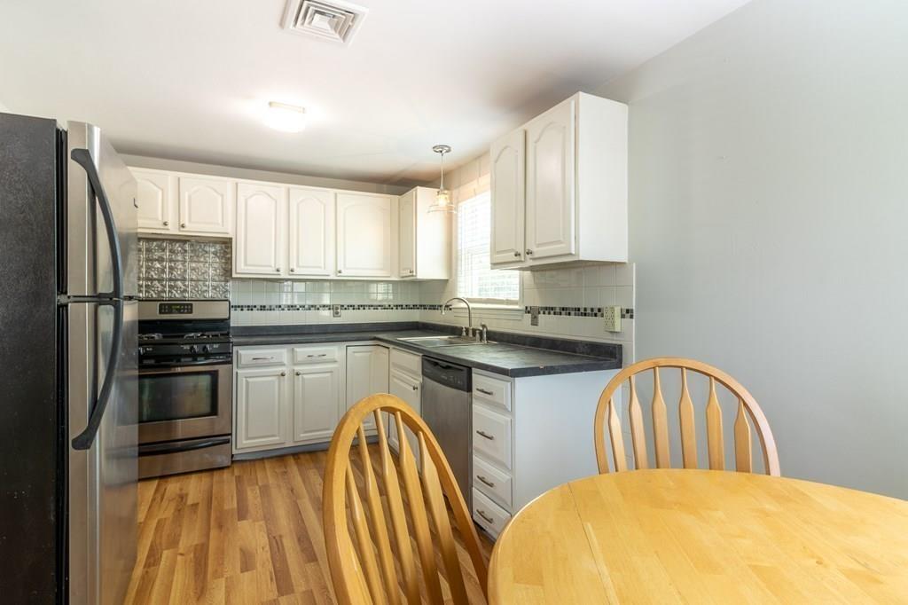 34 Brookline Avenue Hull, MA 02045 - Photo 13 of 40 a kitchen with a sink a stove and refrigerator