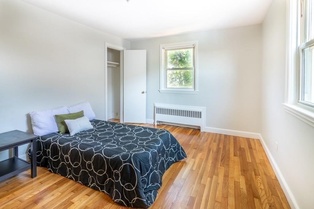 34 Brookline Avenue Hull, MA 02045 - Photo 15 of 40 a bedroom with a bed and a window