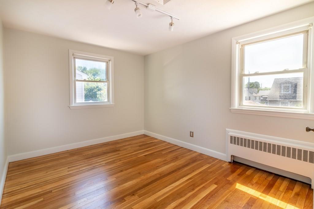 34 Brookline Avenue Hull, MA 02045 - Photo 16 of 40 a view of an empty room with wooden floor and a window