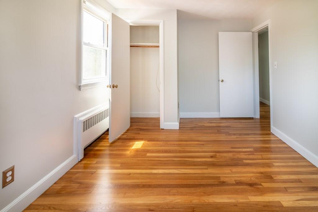 34 Brookline Avenue Hull, MA 02045 - Photo 17 of 40 a view of an empty room with wooden floor