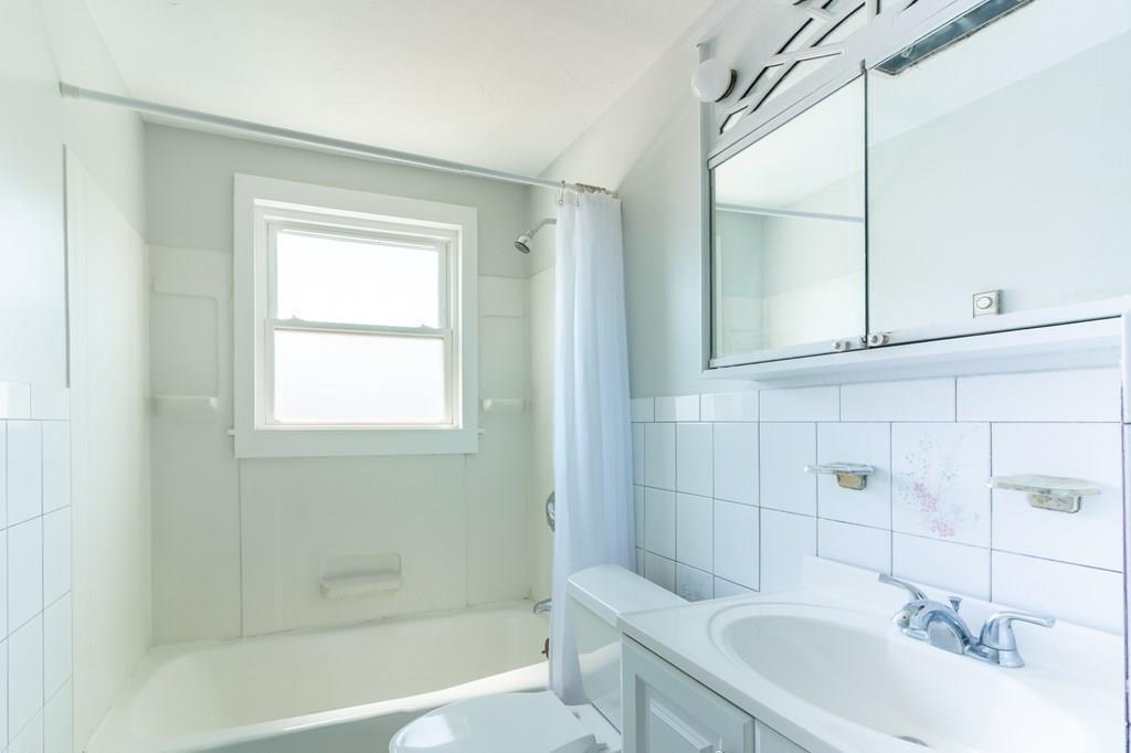 34 Brookline Avenue Hull, MA 02045 - Photo 20 of 40 a bathroom with a sink a toilet and shower