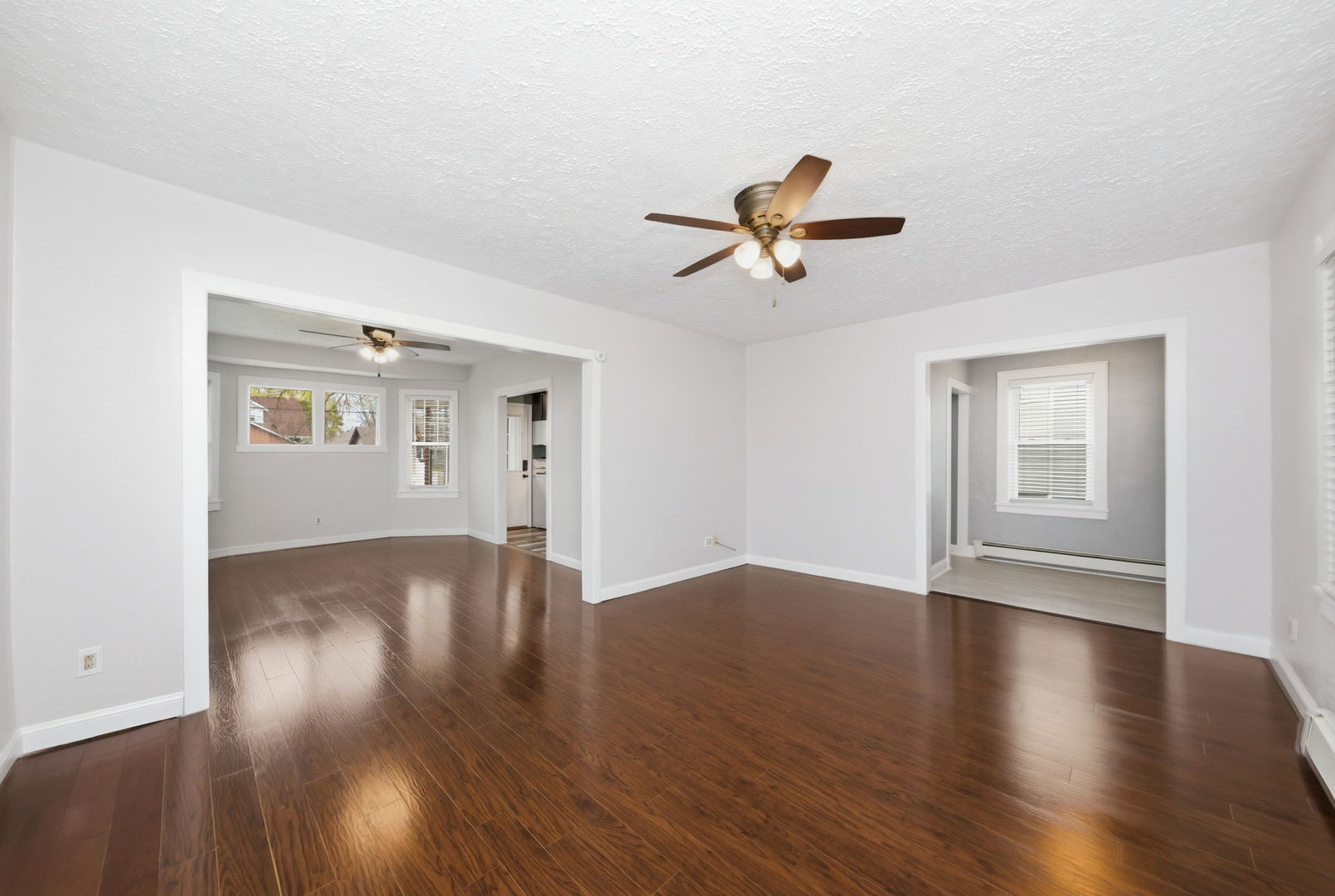 500 Catherine Street Ottawa, IL 61350 - Photo 5 of 23 a view of an empty room with wooden floor and a ceiling fan