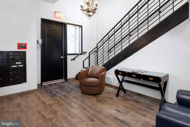 a hallway with furniture and a rug