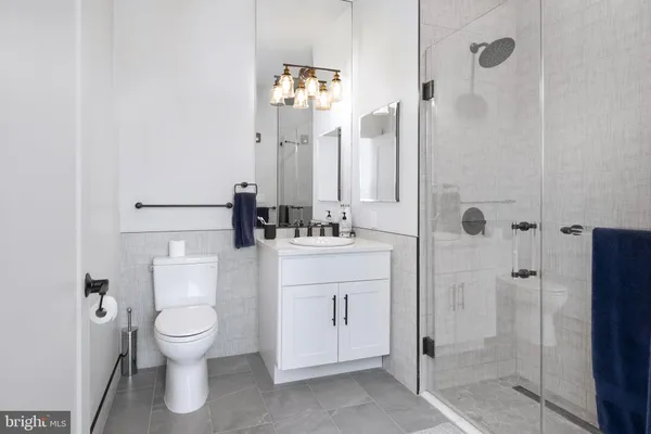 a bathroom with a toilet sink and shower