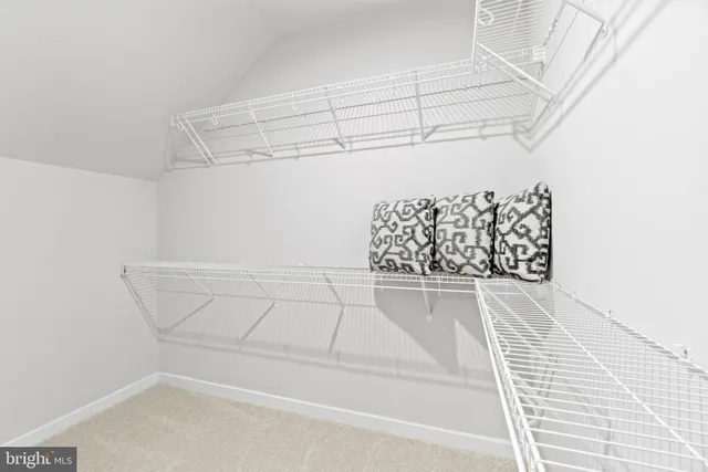 a view of a room with racks on the wall
