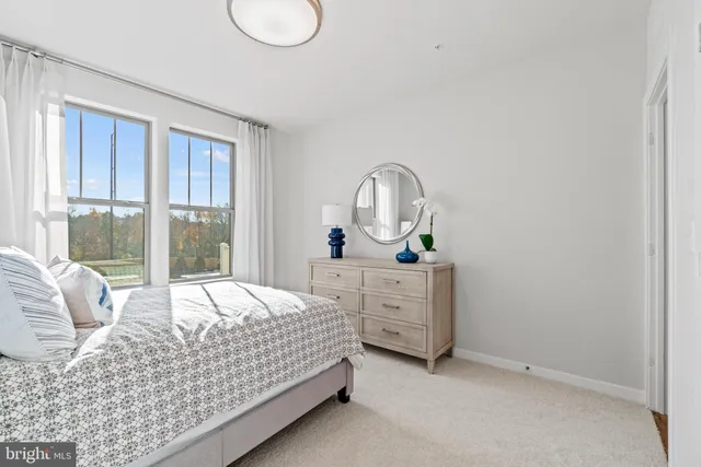 a bedroom with a bed and lamp