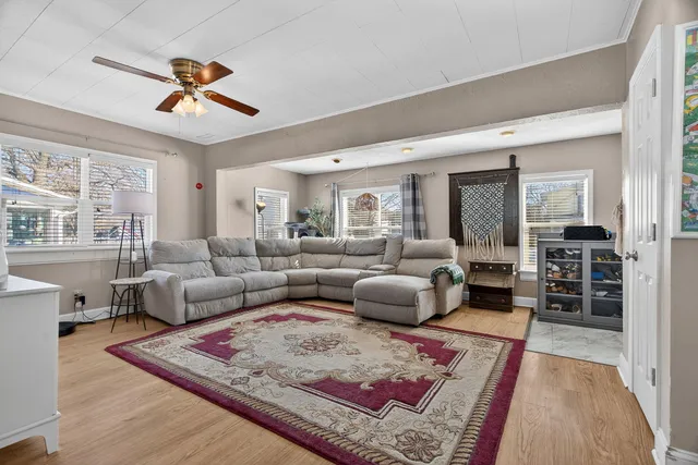 a living room with furniture rug and window