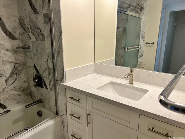 a bathroom with a sink and a bathtub