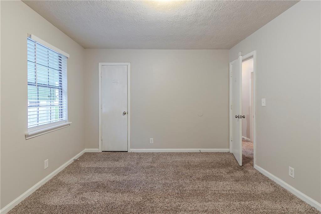 2045 Scarbrough Drive Stone Mountain, GA 30088 - Photo 18 of 26 a view of room with window