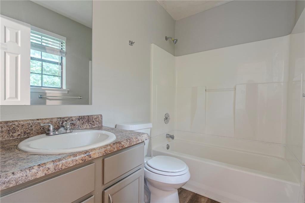 2045 Scarbrough Drive Stone Mountain, GA 30088 - Photo 22 of 26 a bathroom with a sink toilet tub and shower