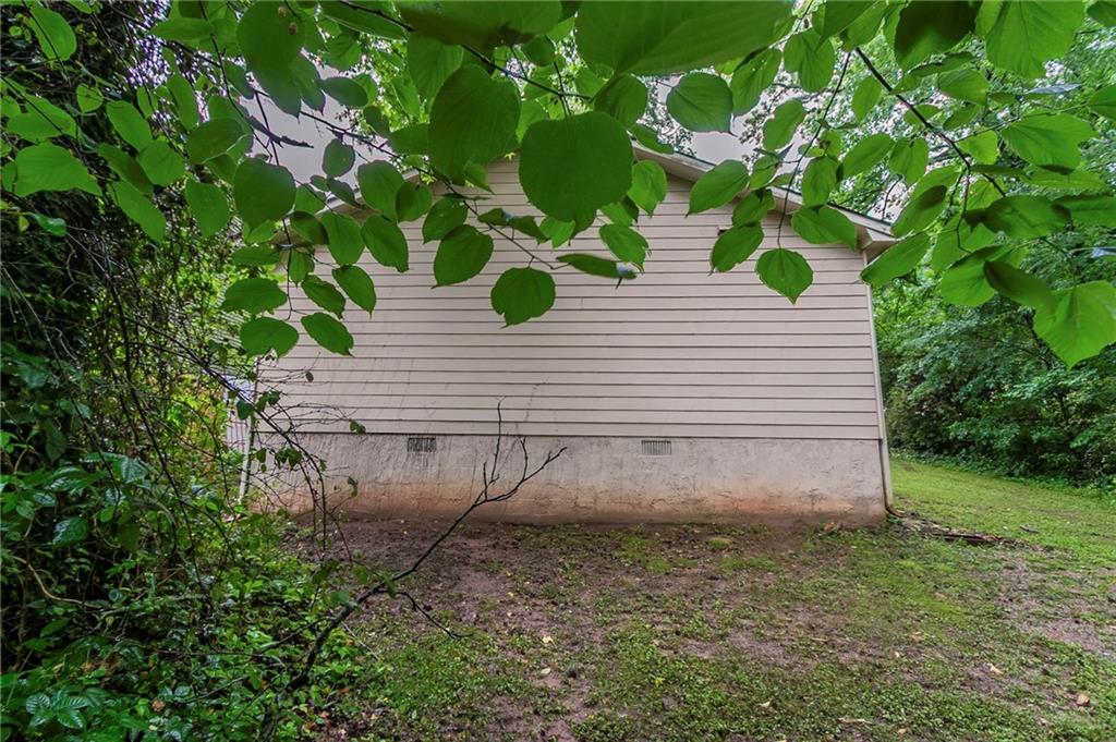 2045 Scarbrough Drive Stone Mountain, GA 30088 - Photo 23 of 26 a view of a house with a yard