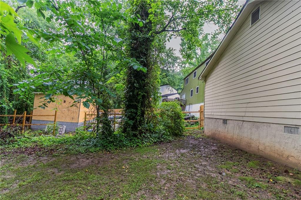 2045 Scarbrough Drive Stone Mountain, GA 30088 - Photo 25 of 26 a view of a backyard with plants and large tree