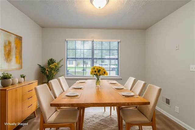 a view of a dining room with furniture window and outside view