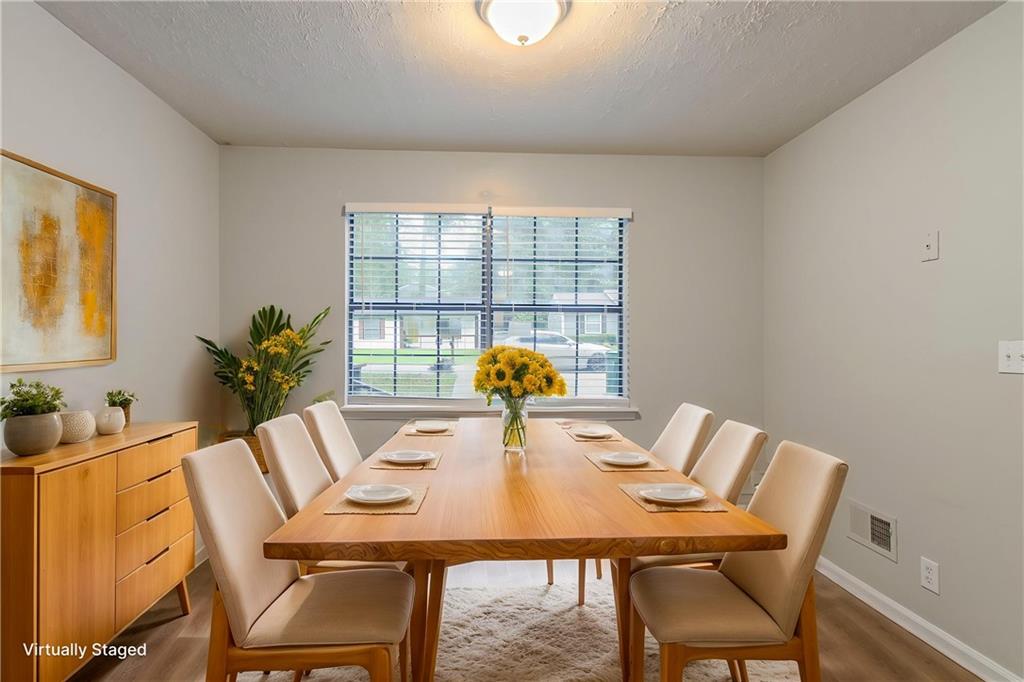 2045 Scarbrough Drive Stone Mountain, GA 30088 - Photo 3 of 26 a view of a dining room with furniture window and outside view