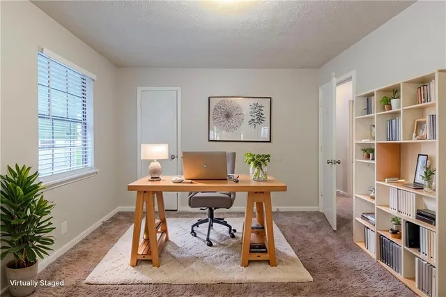 a workspace with furniture and book shelf