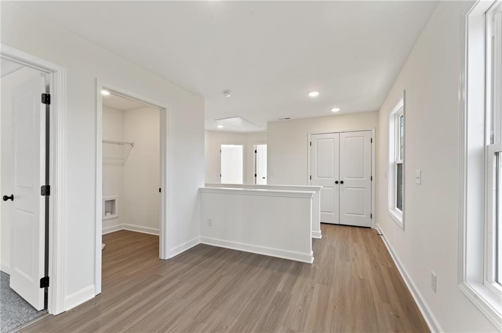 325 Colsen Drive Acworth, GA 30102 - Photo 14 of 25 a view of an empty room and wooden floor