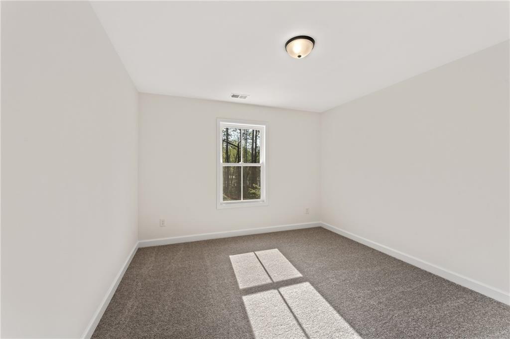 325 Colsen Drive Acworth, GA 30102 - Photo 23 of 25 an empty room with a window
