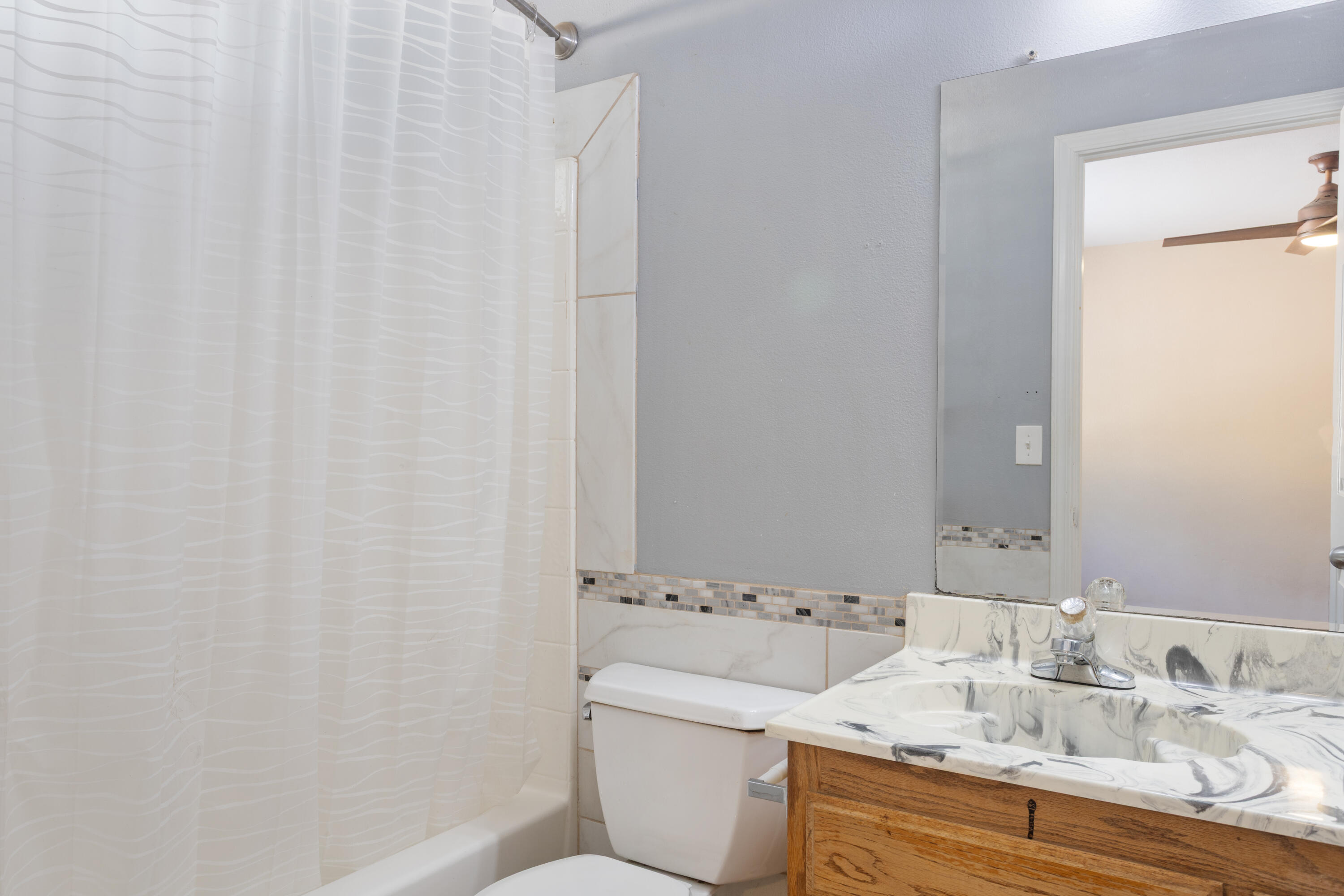 12656 Shalon Drive Redding, CA 96003 - Photo 11 of 21 a bathroom with a granite countertop sink and a mirror
