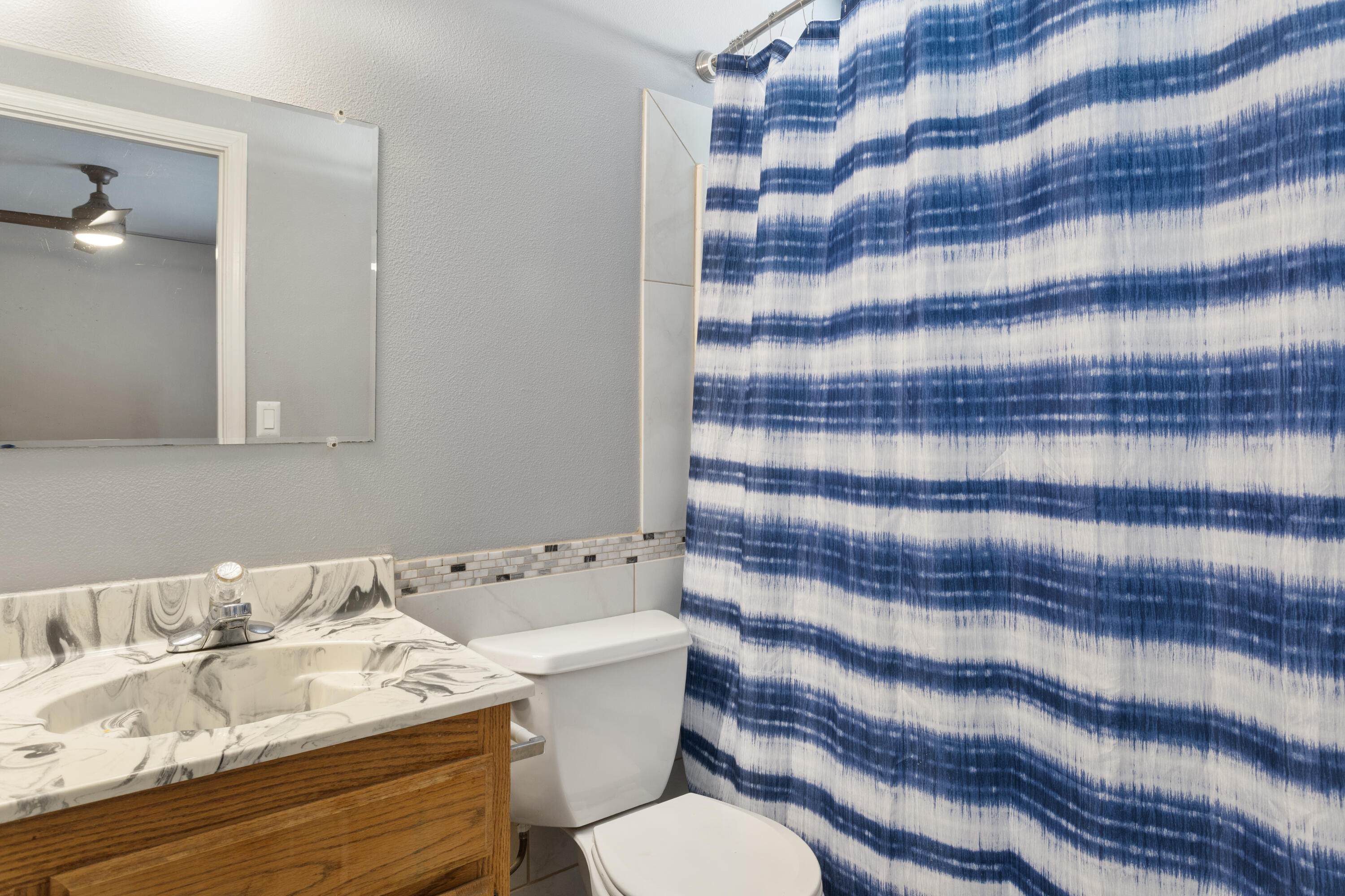 12656 Shalon Drive Redding, CA 96003 - Photo 15 of 21 a bathroom with a sink toilet and shower