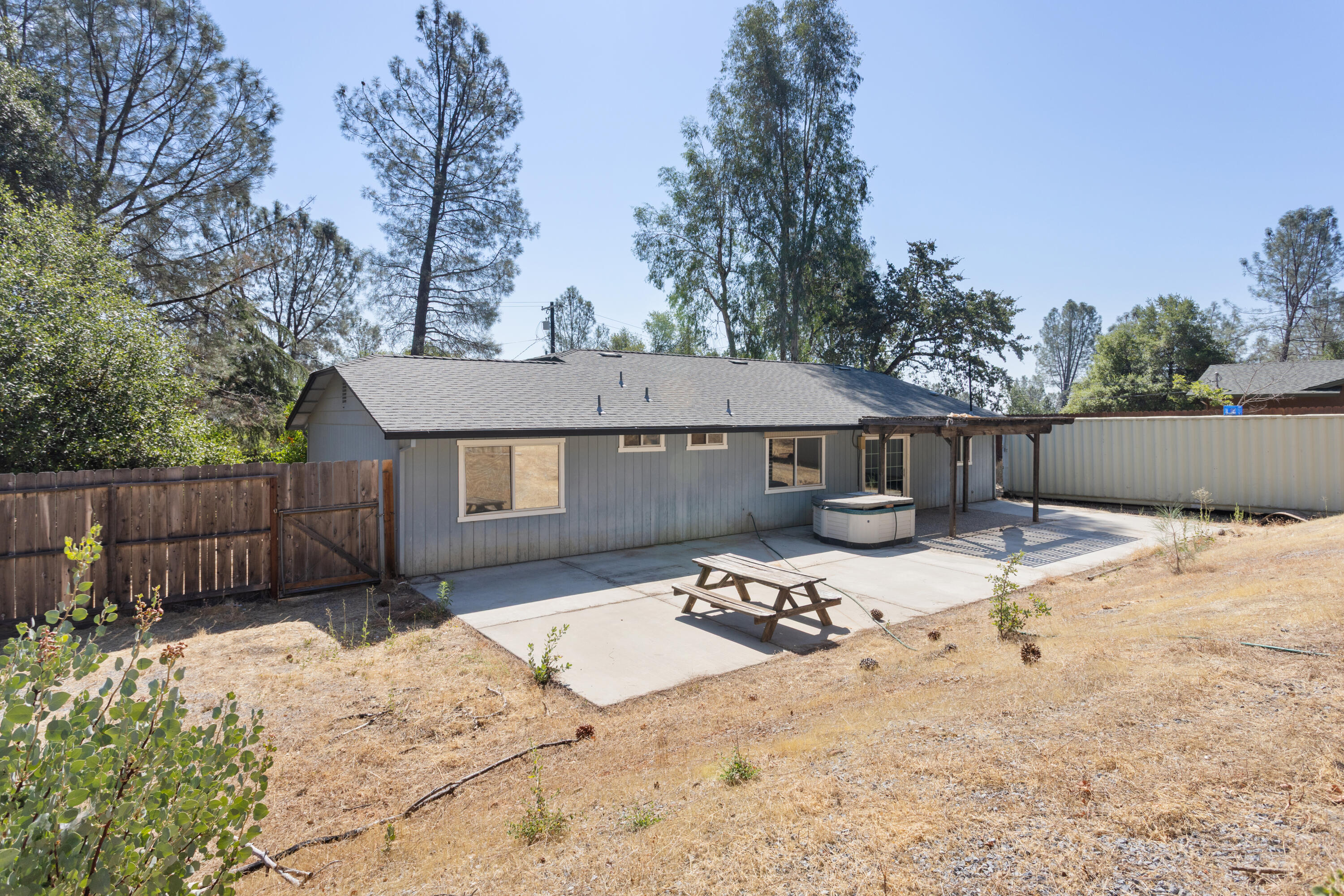 12656 Shalon Drive Redding, CA 96003 - Photo 17 of 21 a front view of a house with a yard covered in snow