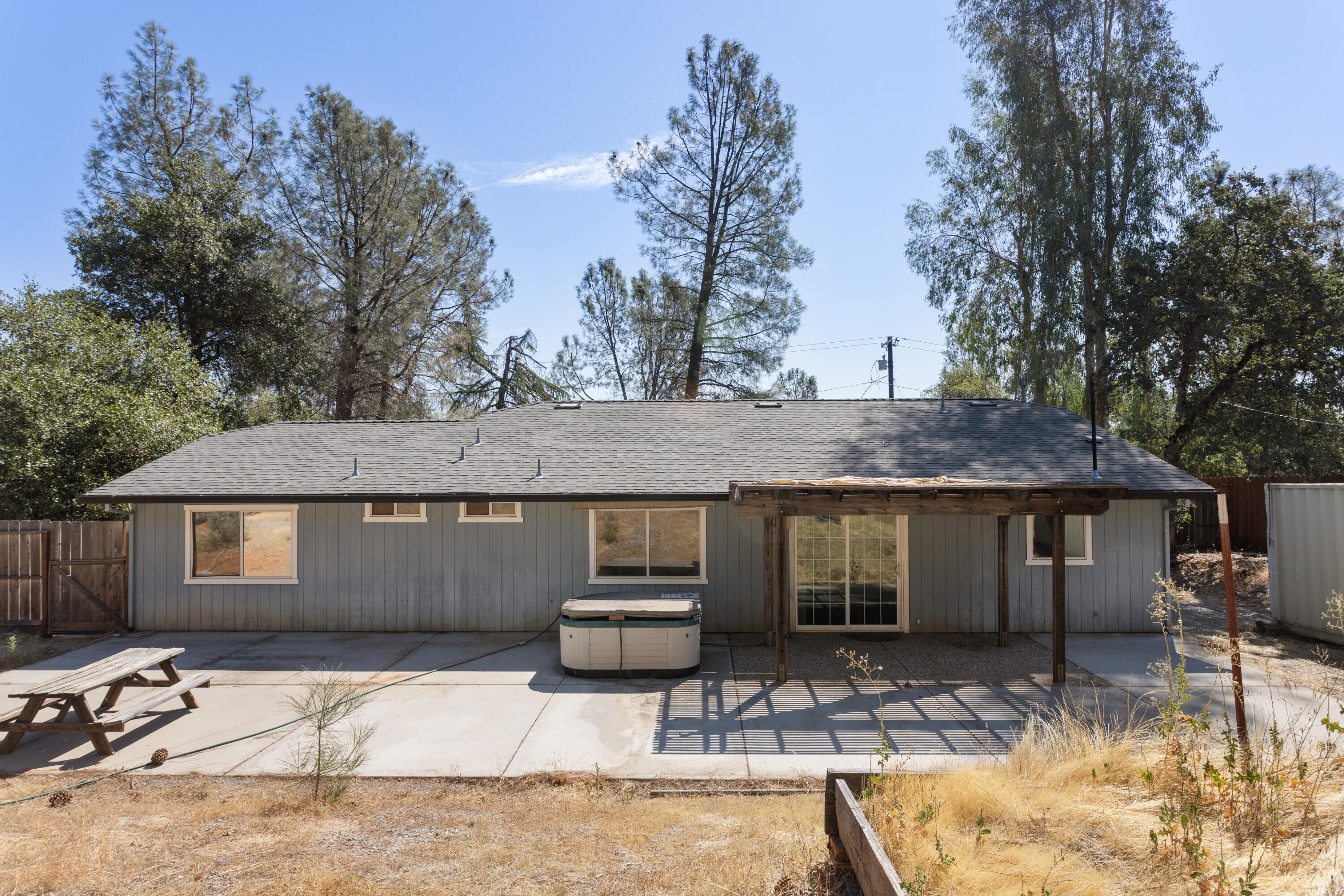 12656 Shalon Drive Redding, CA 96003 - Photo 18 of 21 a front view of a house with garden