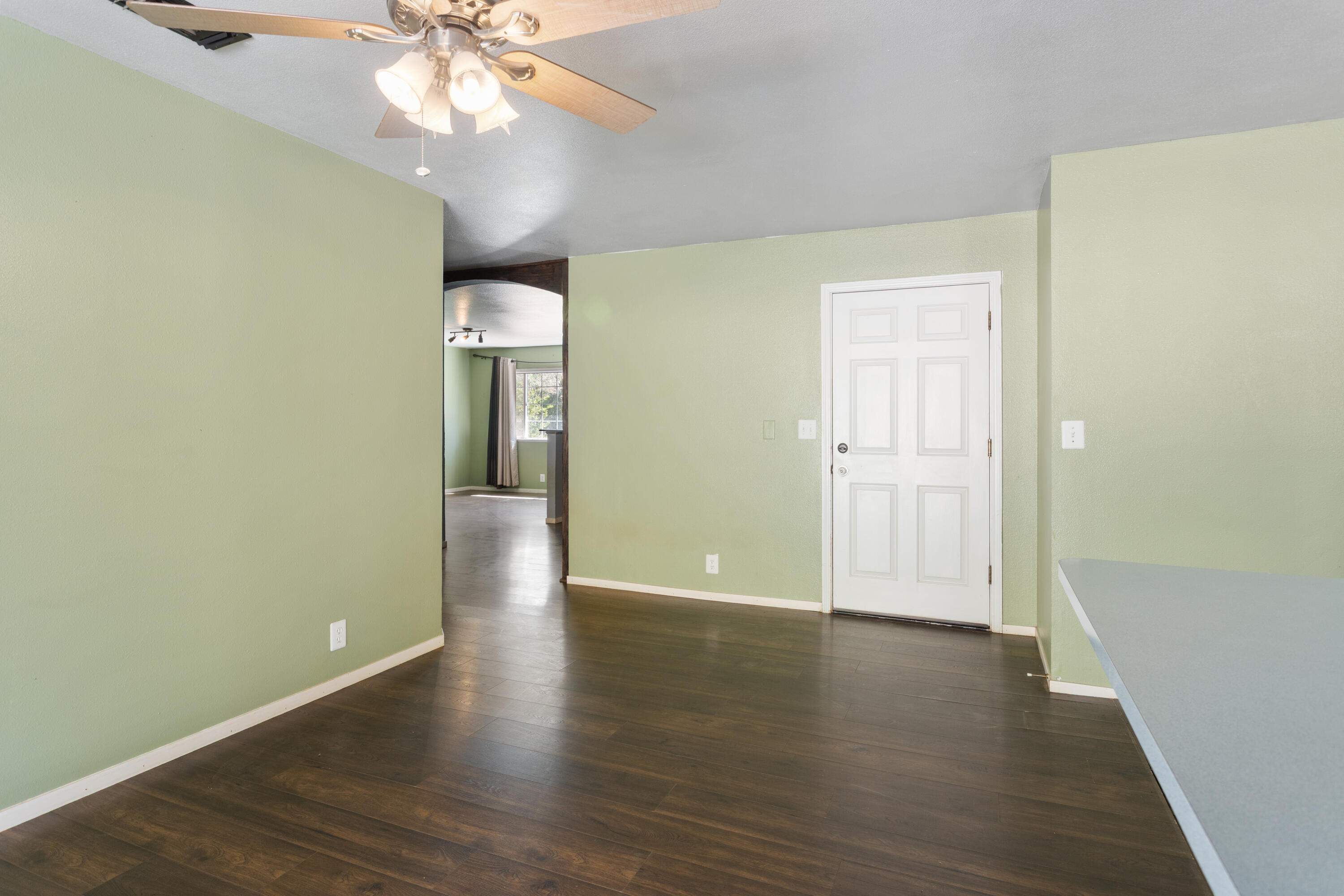 12656 Shalon Drive Redding, CA 96003 - Photo 4 of 21 wooden floor in an empty room with a window