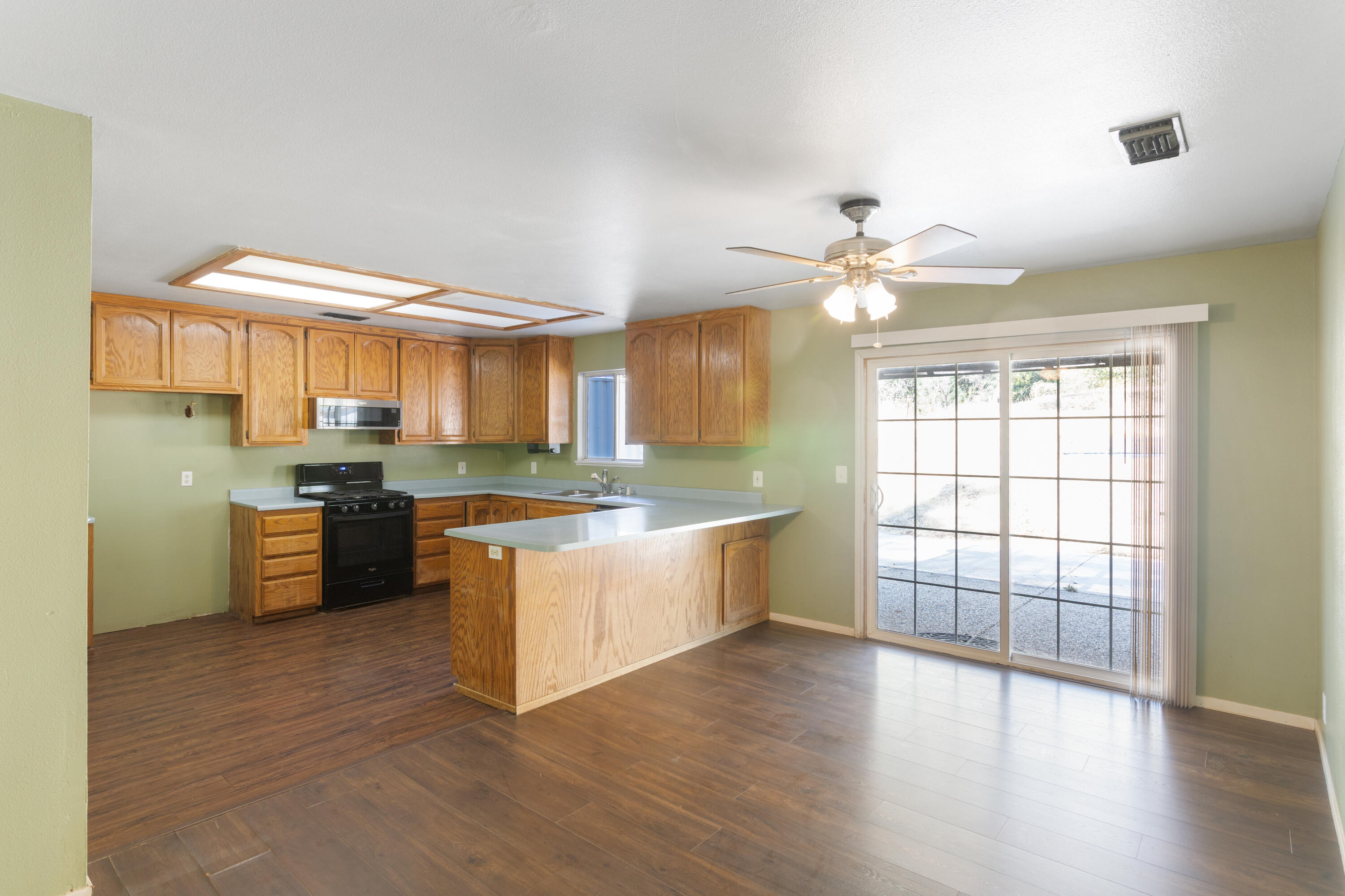12656 Shalon Drive Redding, CA 96003 - Photo 6 of 21 a large kitchen with a large window a sink and a counter top space