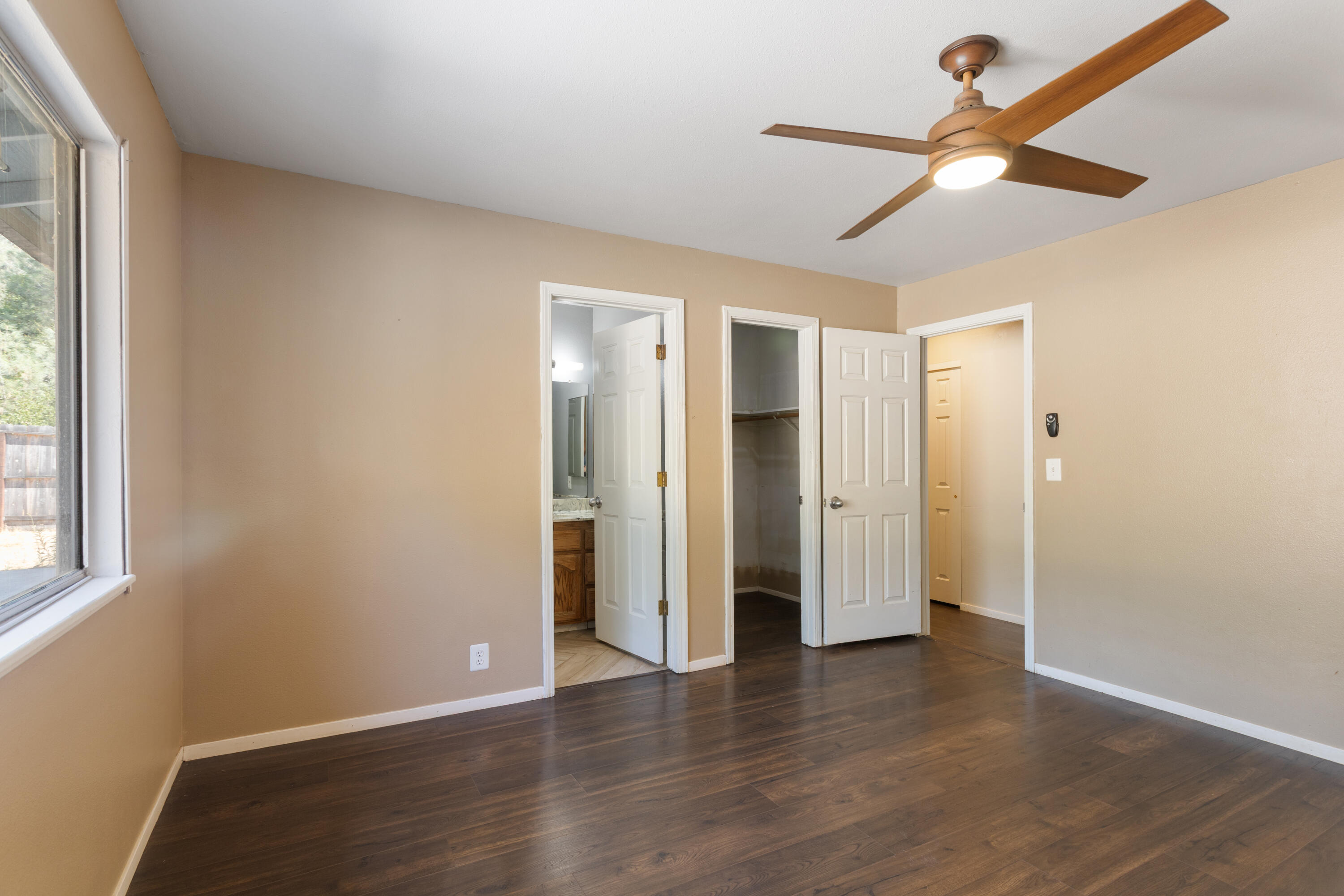 12656 Shalon Drive Redding, CA 96003 - Photo 10 of 21 a view of empty room with wooden floor and fan