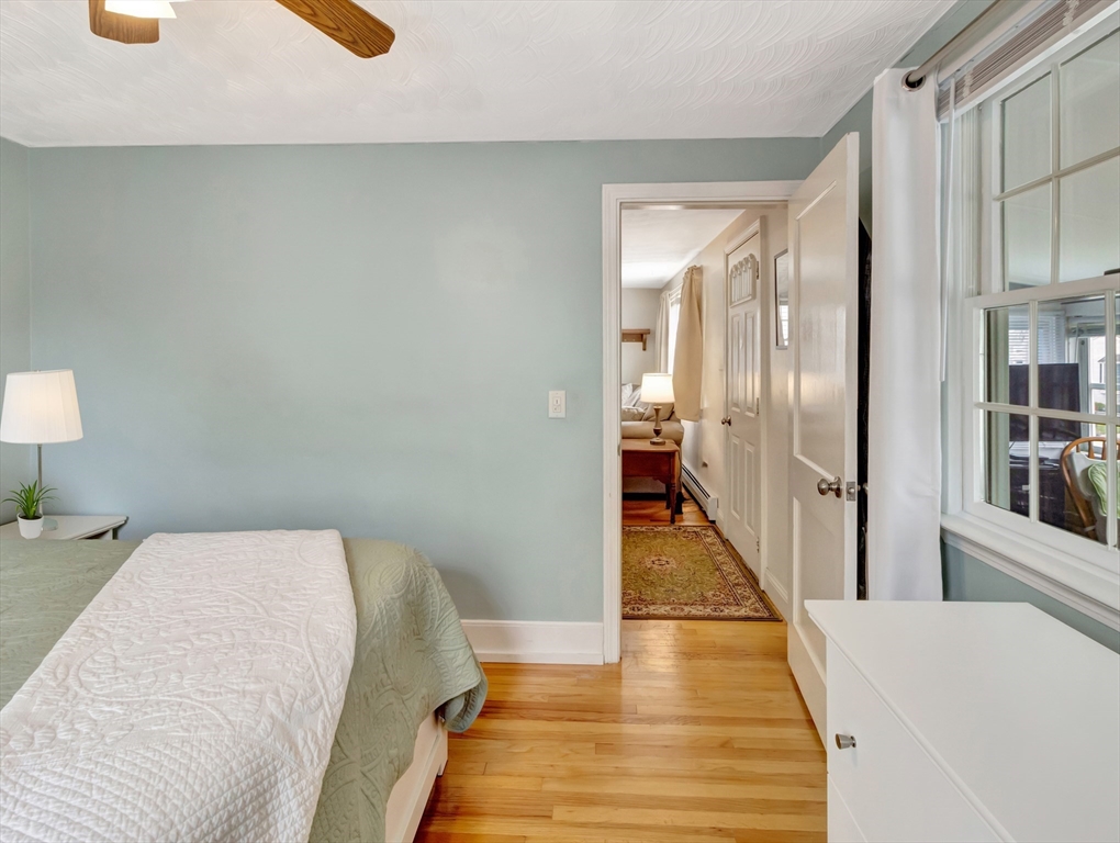5 G Street Hull, MA 02045 - Photo 27 of 41 a bedroom with a bed and a book shelf