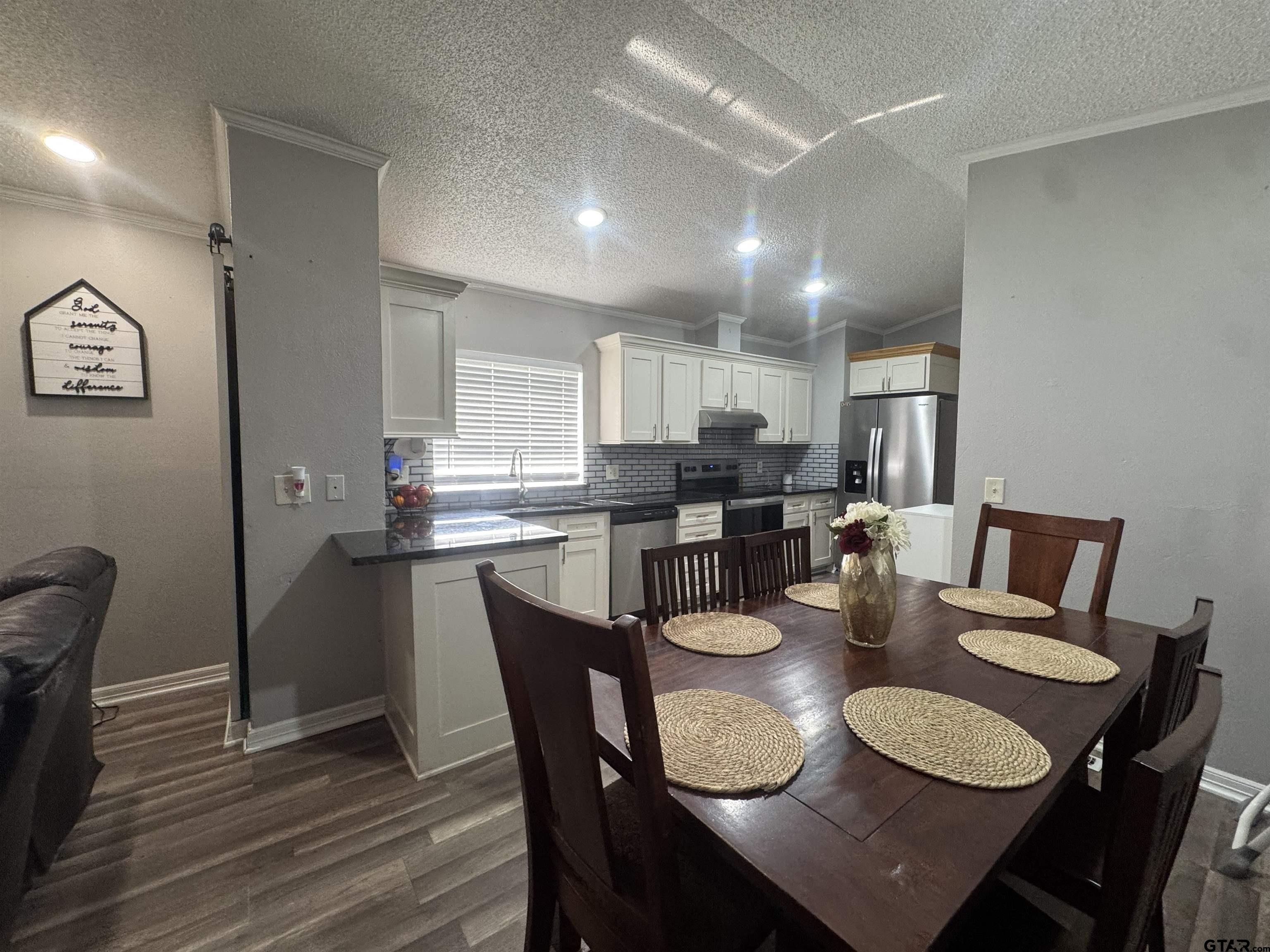 8261 County Road 381 Tyler, TX 75708 - Photo 15 of 24 a dining room with furniture and wooden floor