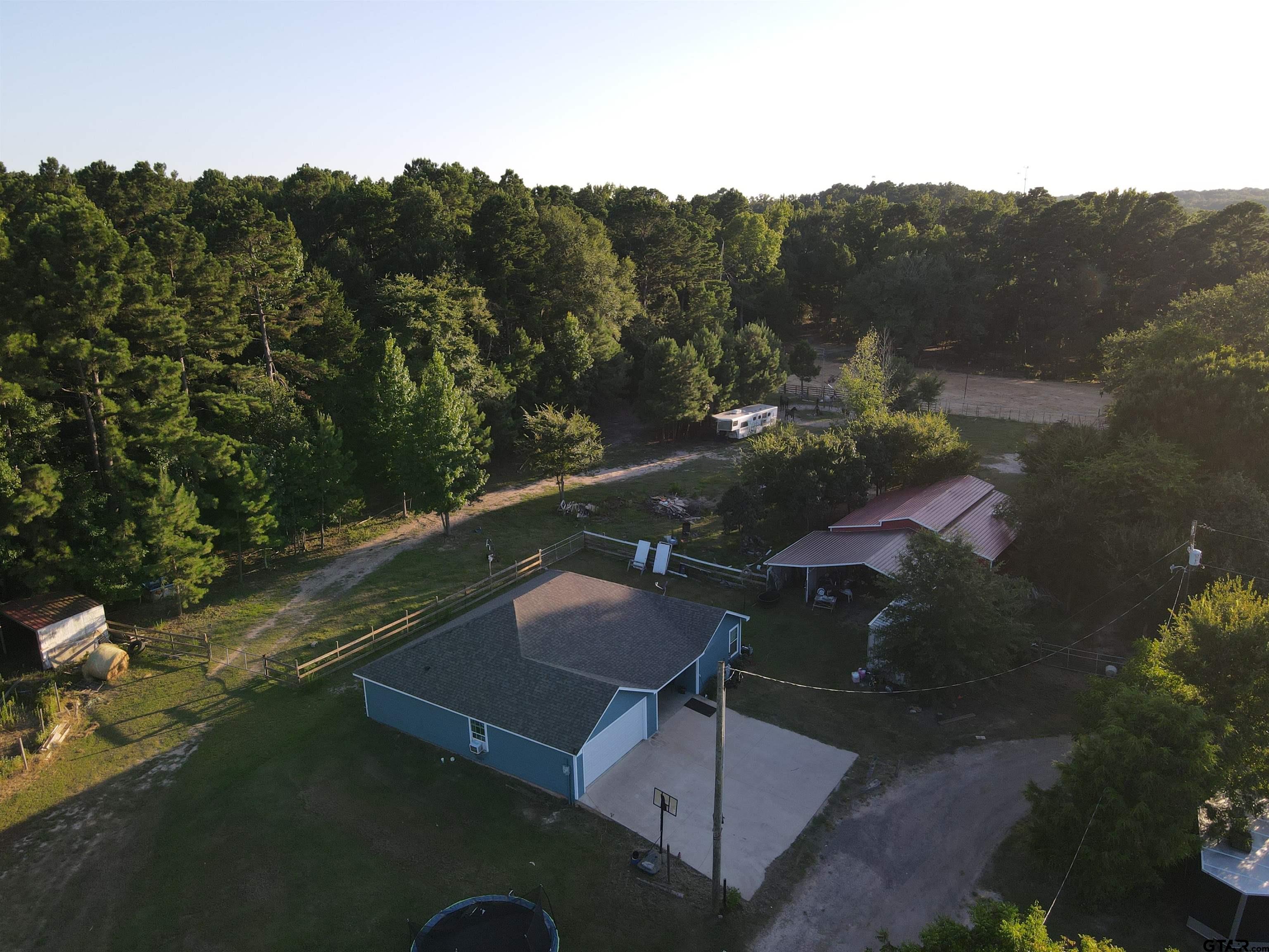 8261 County Road 381 Tyler, TX 75708 - Photo 24 of 24 a view of a pool with a yard